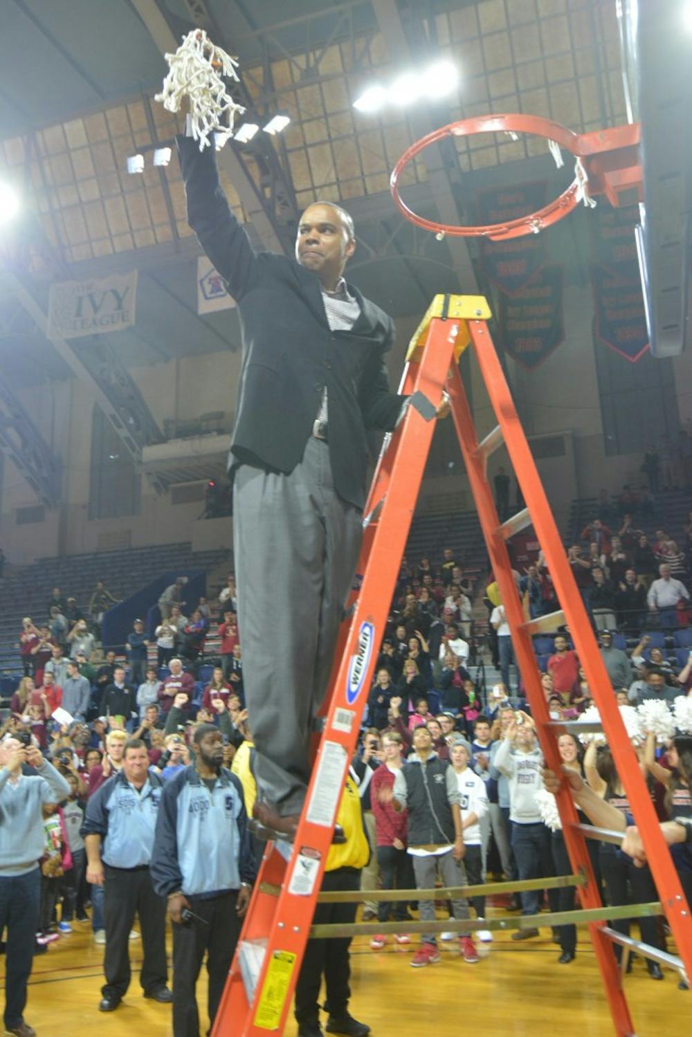 Harvard coach Tommy Amaker cuts down the nets at the Palestra after the Crimson took down Yale, 53-51, in the Ivy League Playoff for an automatic bid into the NCAA Tournament.