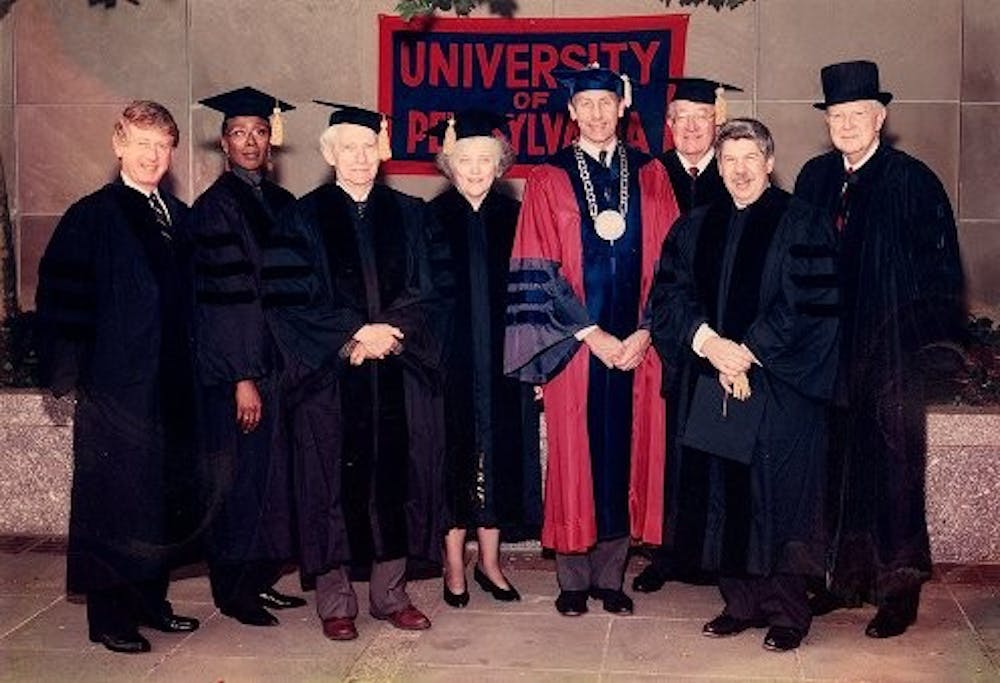 	Sheldon Hackney poses with honorary degree recipients at a Penn commencement.