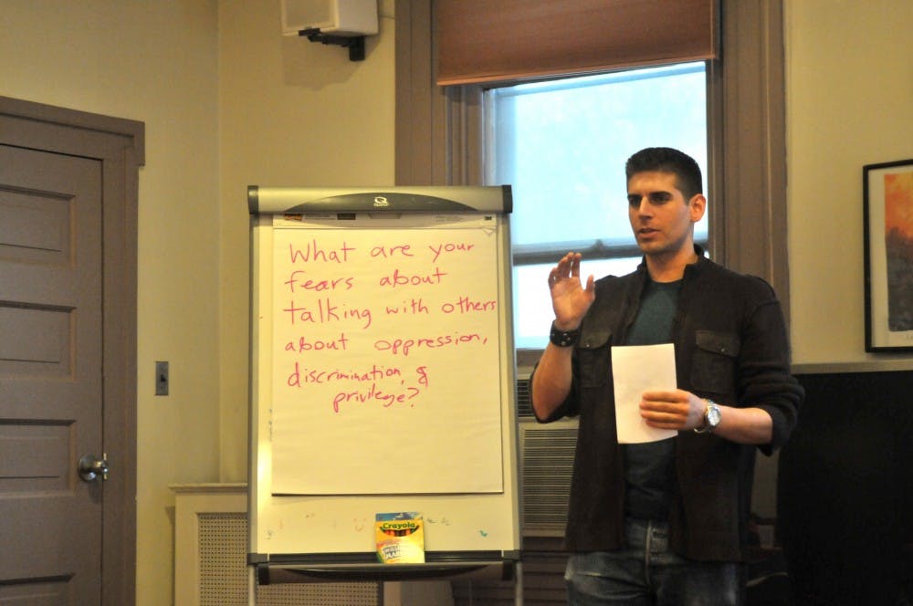 Carlos Gomez, author of book Man Up, speaks about ethic and cultural oppression at the Greenfield Intercultural Center.