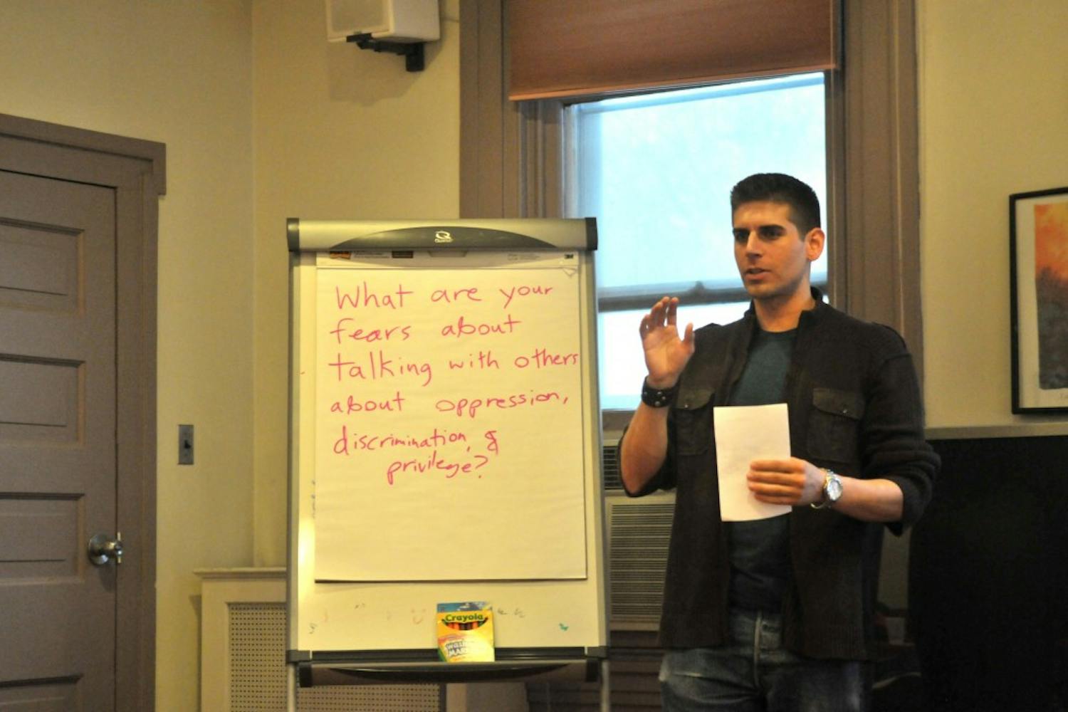 Carlos Gomez, author of book Man Up, speaks about ethic and cultural oppression at the Greenfield Intercultural Center.