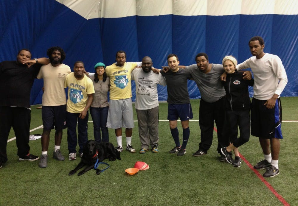 (From left) Mark Cooper, volunteer Tom Laws, Walt Harris, Street Soccer Philadelphia director Chandrima Chatterjee, Mark Walker, Ellish Danzy, Street Soccer Chicago director Otto Rodriguez, Reef Barclay, volunteer Julie Platt and another team member gather for practice at Dunning-Cohen Champions Field on Feb. 19. 
