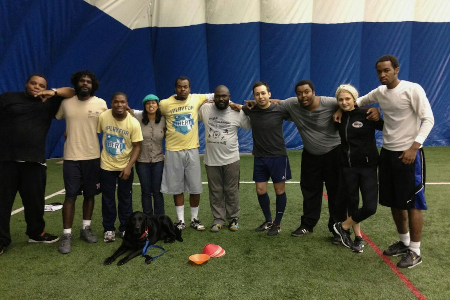 (From left) Mark Cooper, volunteer Tom Laws, Walt Harris, Street Soccer Philadelphia director Chandrima Chatterjee, Mark Walker, Ellish Danzy, Street Soccer Chicago director Otto Rodriguez, Reef Barclay, volunteer Julie Platt and another team member gather for practice at Dunning-Cohen Champions Field on Feb. 19.