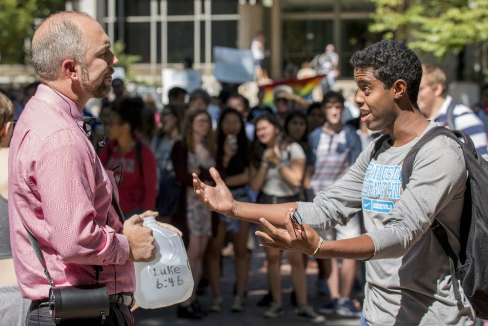 Photo Gallery | Preacher sparks protest at Penn