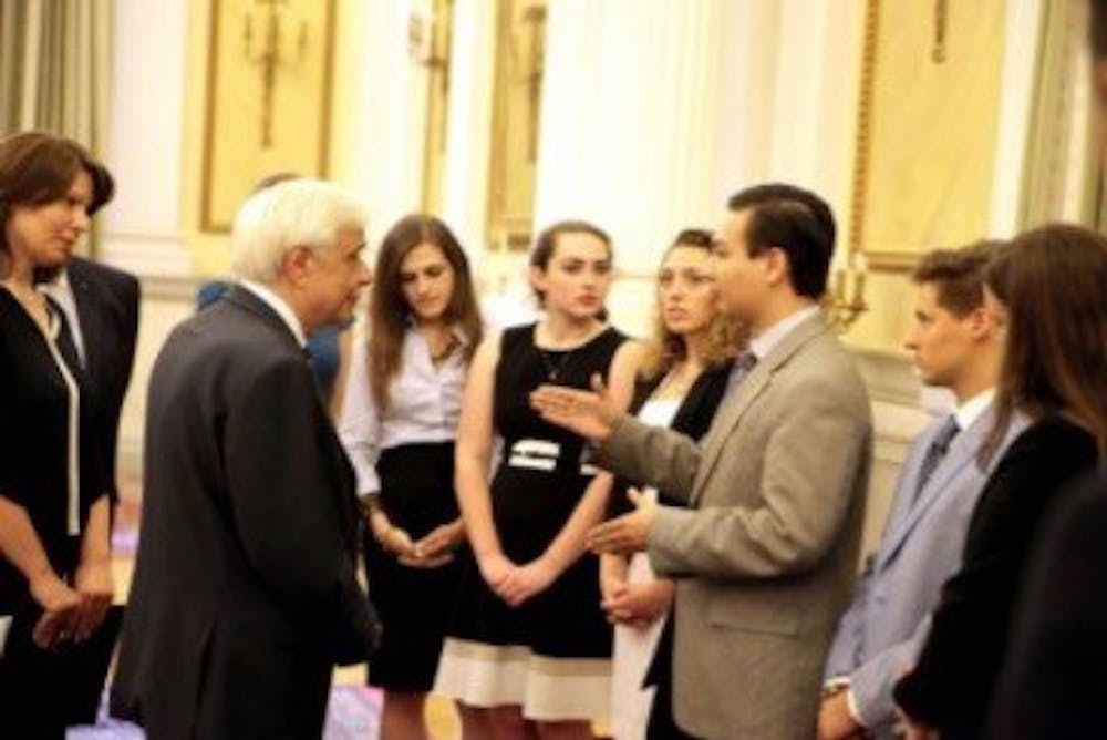 <p>Penn student <strong>Elias Gerasoulis</strong> discussed the Greek economic crisis with President of Greece Prokopis Pavlopoulos. | Courtesy of American Hellenic Institute</p>