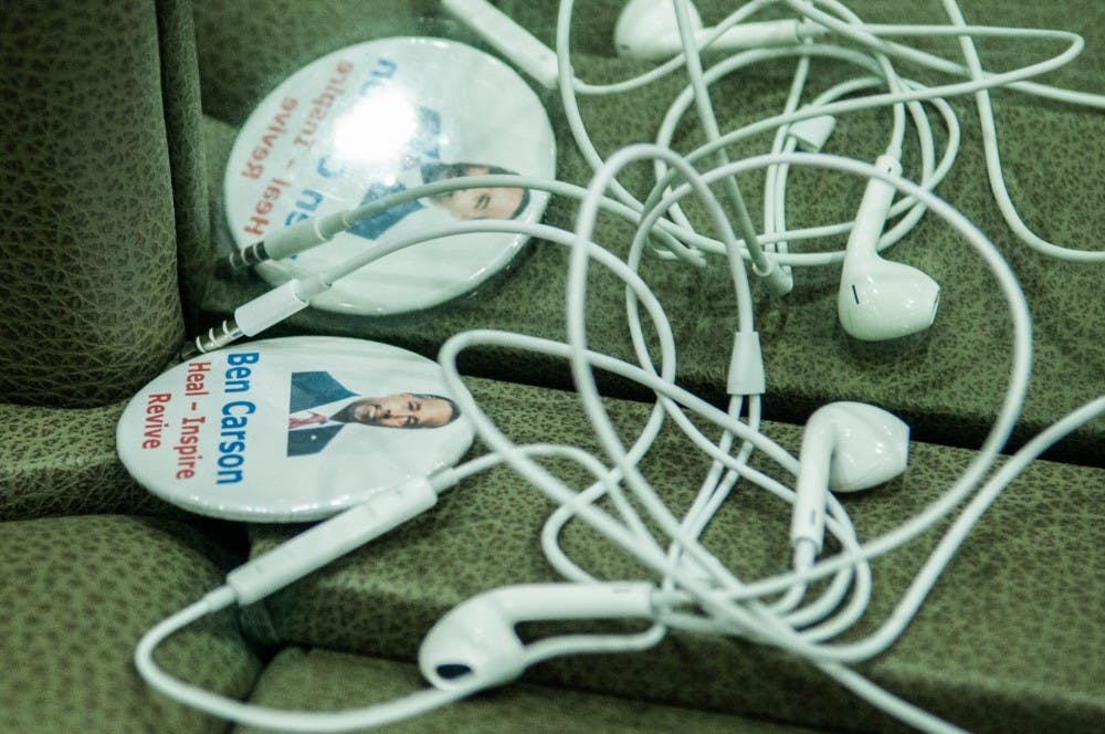 A campaign button and jumbled pair of headphones lay in the lounge in the back of Carson's campaign bus, evidence of the staffers' long hours spent on the road over the last few months.