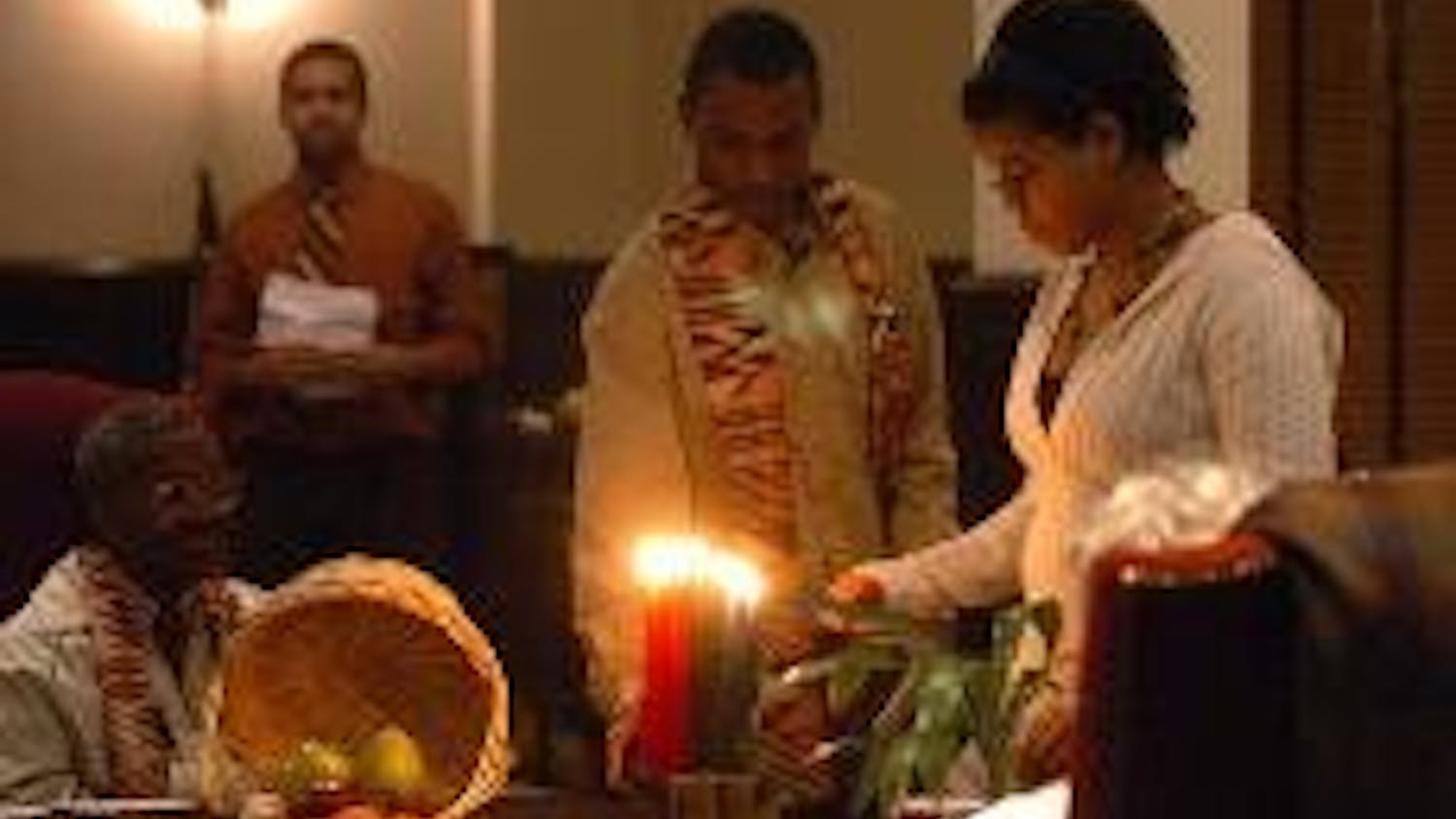 Lighting candles in celebration of unity