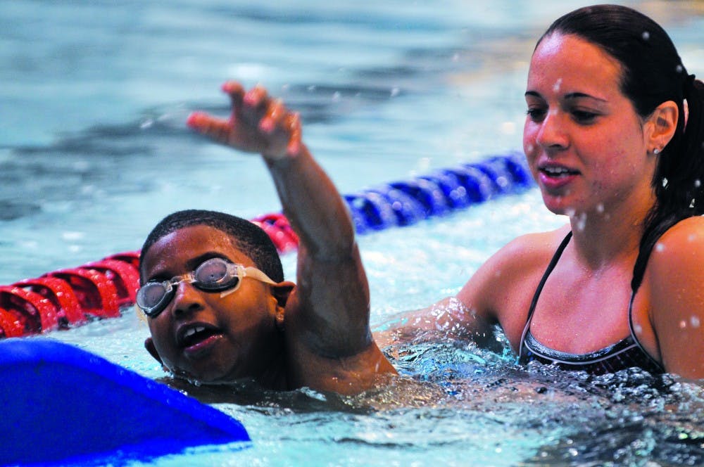 "We Can Swim!" community swim program led by varsity swimmer Clarissa Palmer and assistant coaches Dan Schupsky and Marc Christian