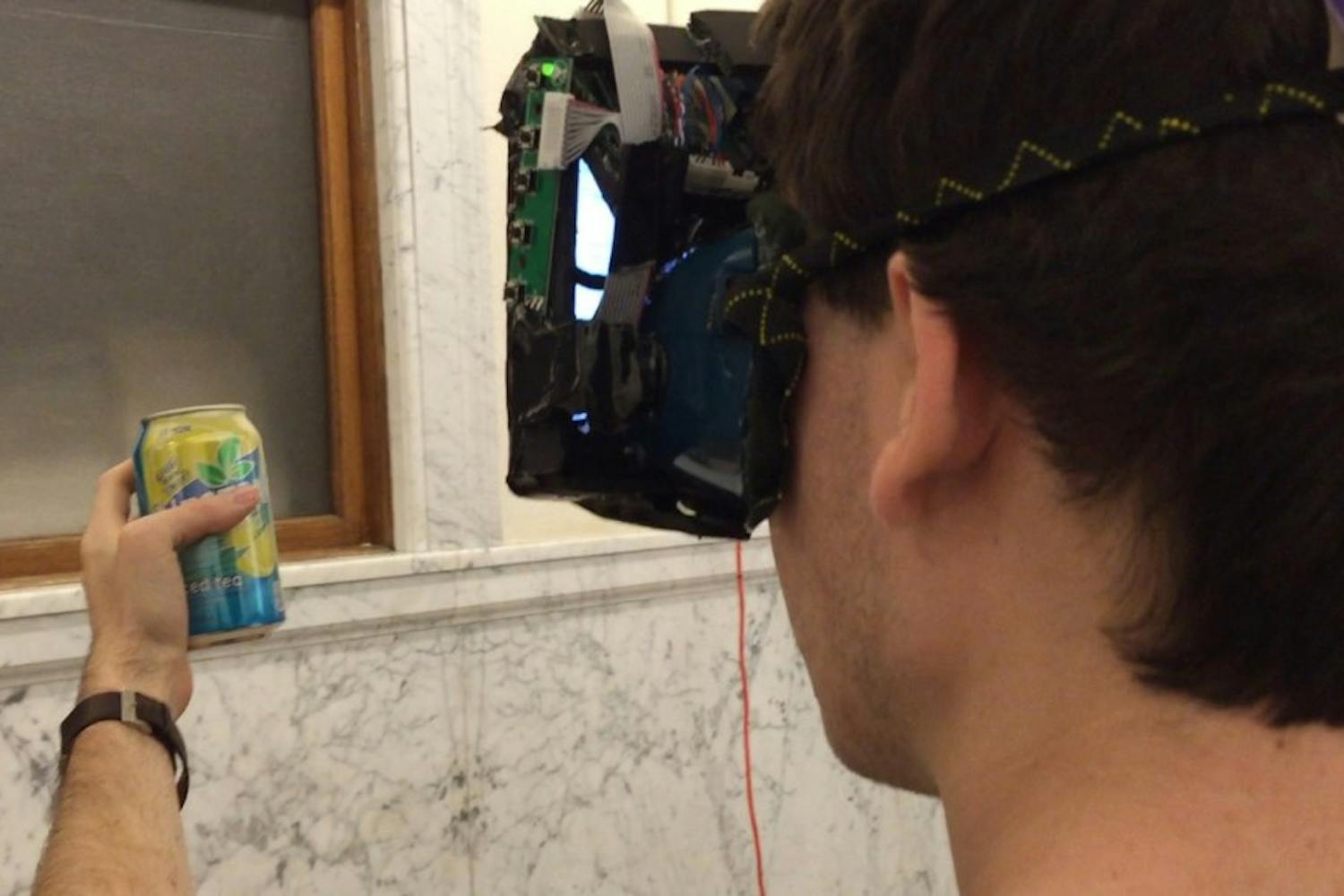 The Brand Killer helmet blocks out real-life advertisements by making them appear blurry to the viewer.