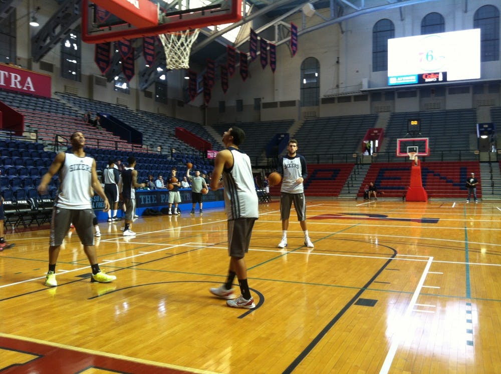 	Members of the Philadelphia 76ers shoot around during their free open practice at the Palestra.