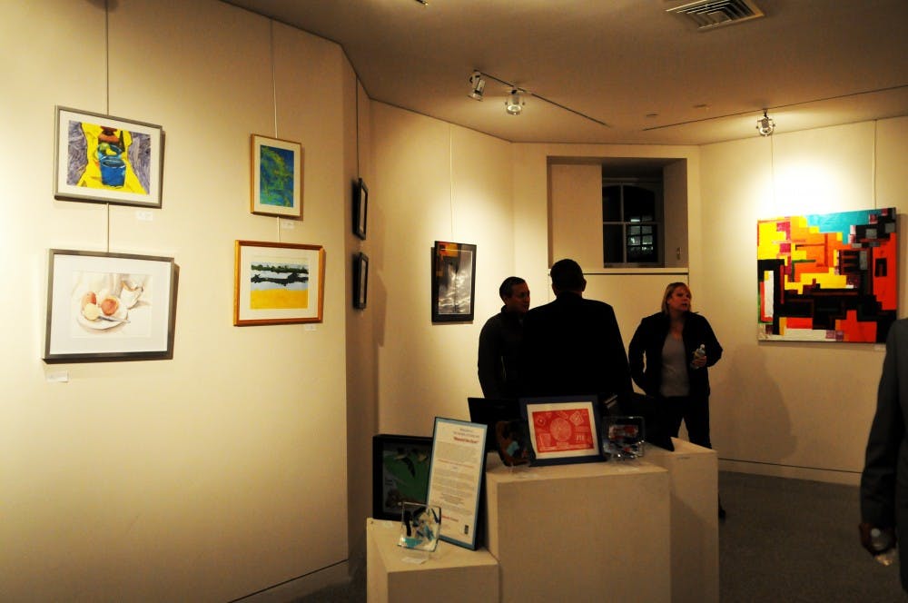 A Management 100 Team hosted an art exhibit in partnership with with local nonprofit CareLink on Tuesday night. The exhibit 