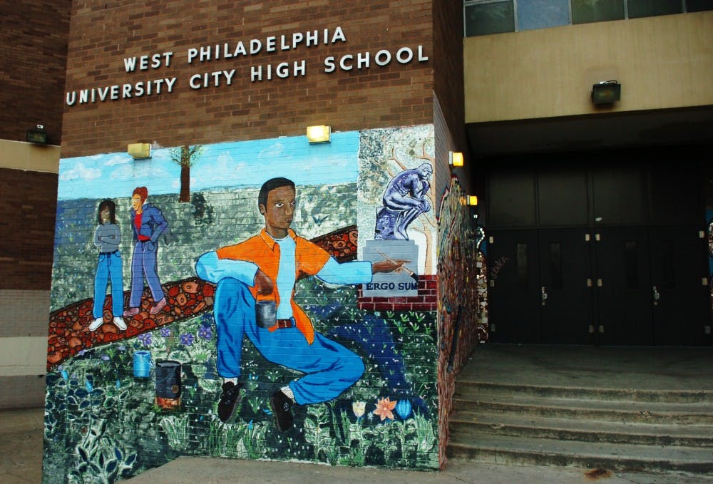 Murals outside University City High School, located at 36th and Filbert streets, illustrate the school's close relationship with the community.