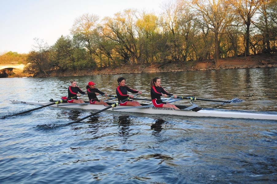The women's and men's heavyweight rowing teams practice in the early morning on the Schuylkill. 