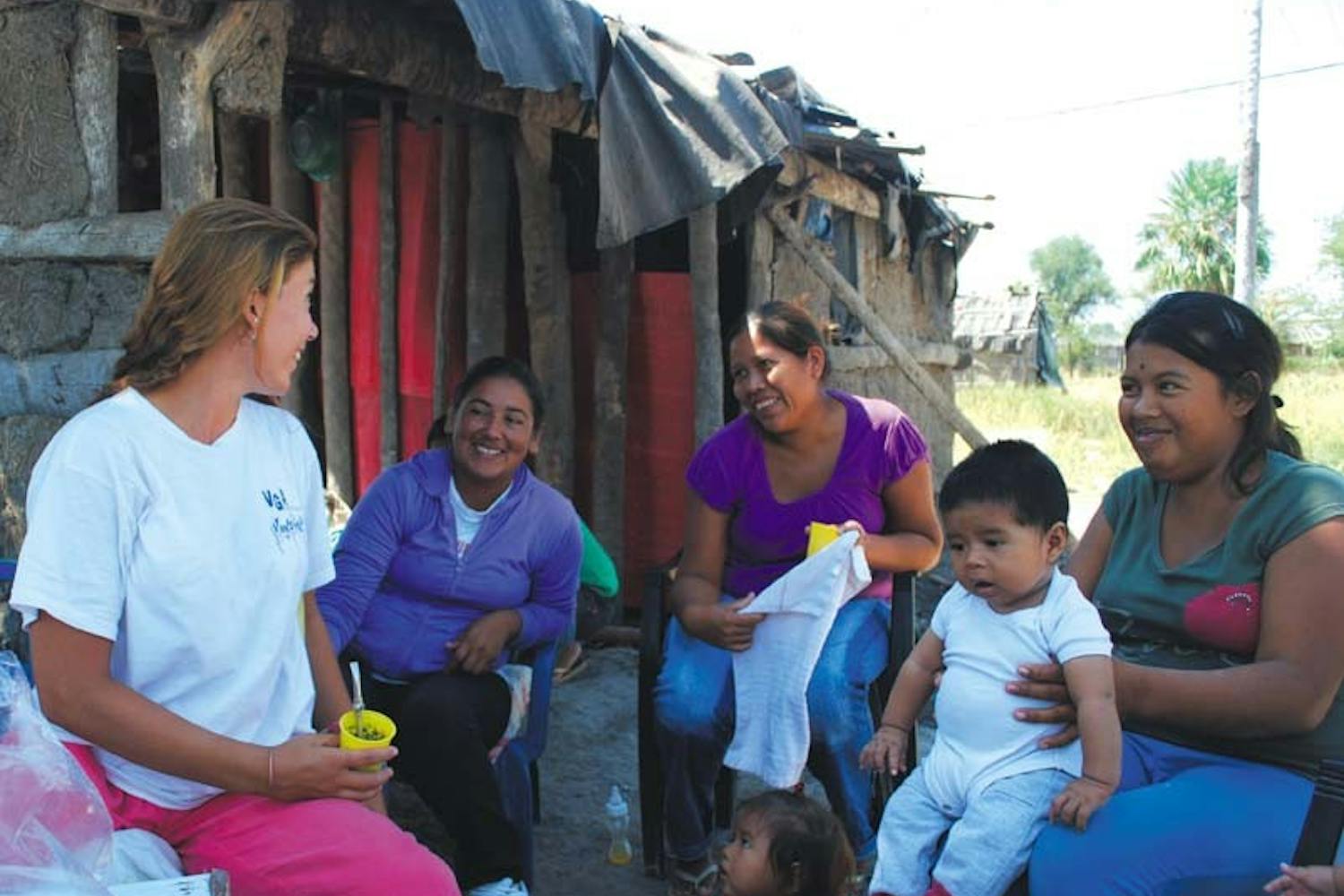 Claire Stingley (left), a 2012 College graduate, talks with a field assistant and two mothers who are participating in the Fundación ECO’s study on babies and fertility. The Fundacion was founded by two Penn professors in 1999.