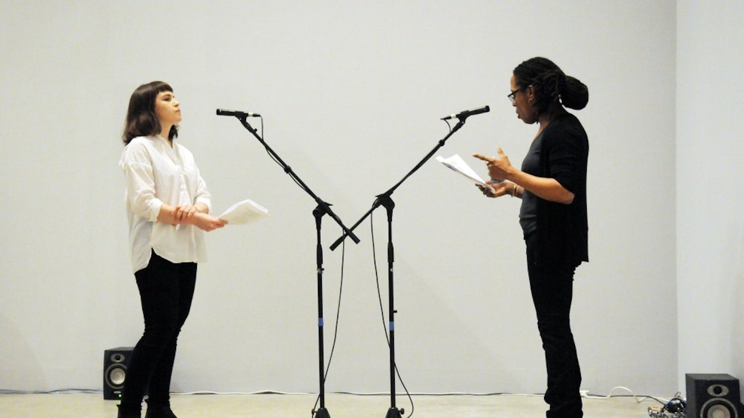 Martyna Majewska and Deanna Bowen perform "Interview of Robert Shelton" by Paul Good as part of the ICA Winter Exhibition Opening.