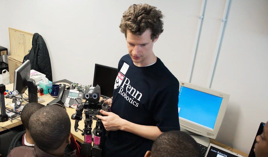 Student mentor Stephen McGill gives a tour of the GRASP Laboratory.