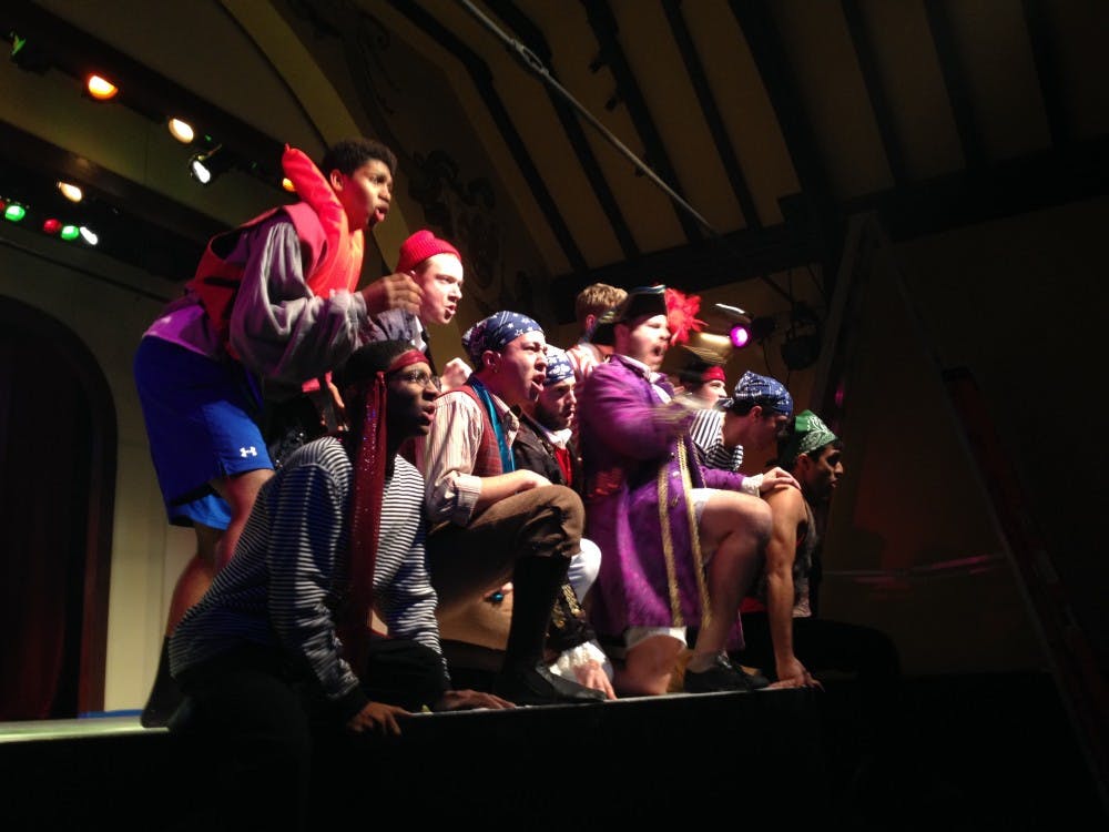 	Members of Mask &amp; Wig rehearse for their up coming show. 