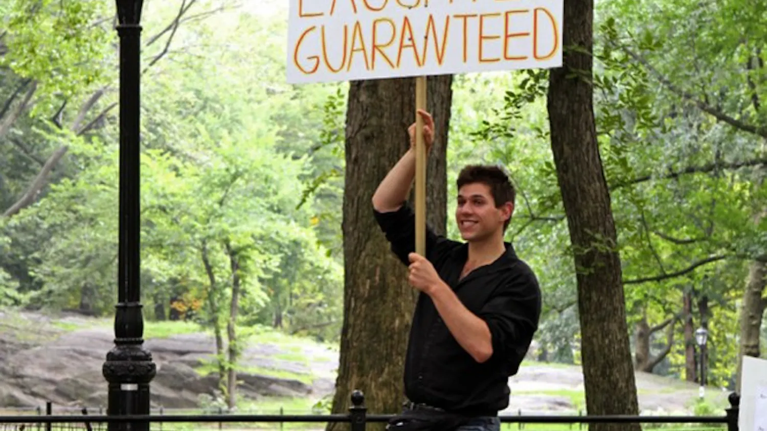 Jason Schneider tells jokes in Central Park
