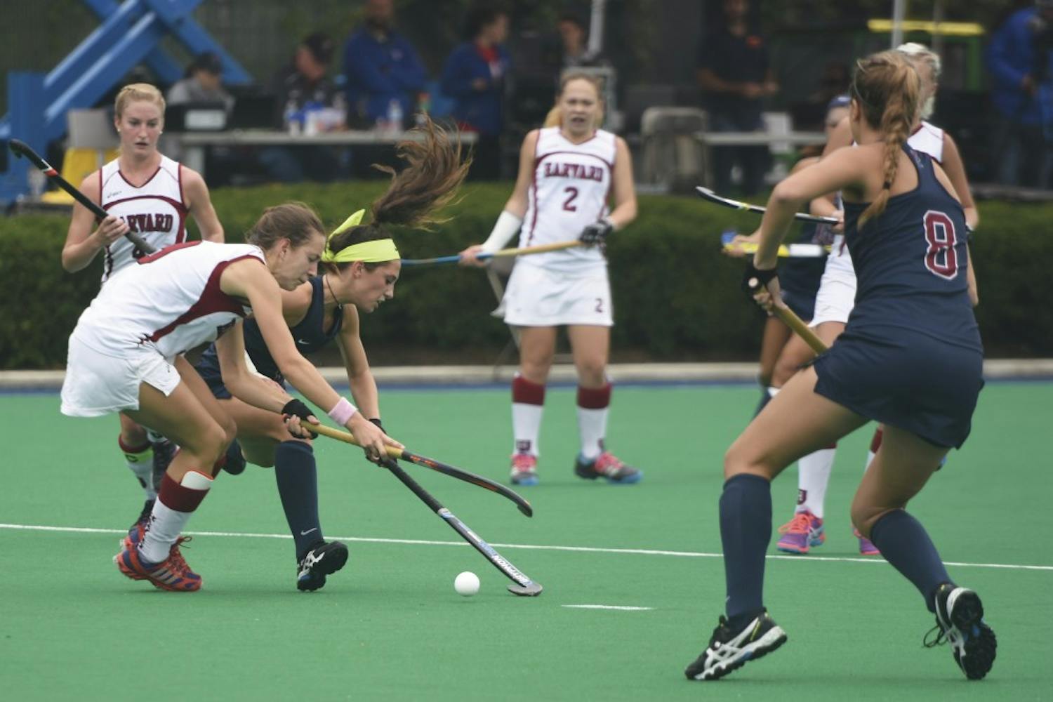 In her trademark neon headband, junior attack Alexa Hoover scored two goals against Harvard to break Penn field hockey's all-time record for goals in her team's 3-2 loss over the weekend. 