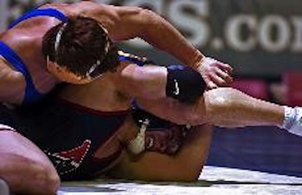 Wrestling | Alton towers over Quakers