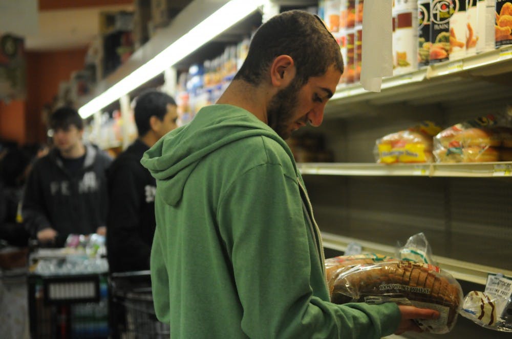 Students pack Fresh grocer in preparation for Hurricane Sandy