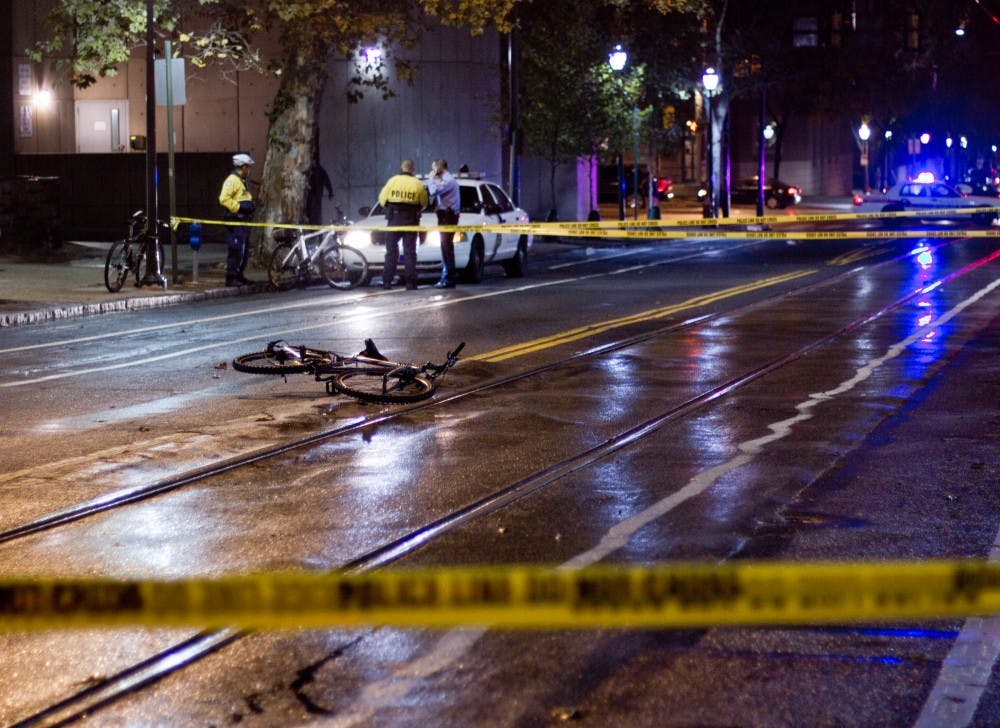	The bicycle of an unaffiliated female hit by a car at 39th and Spruce streets lies in the middle of the road. She is being treated at the Hospital of the University of Pennsylvania for her injuries.