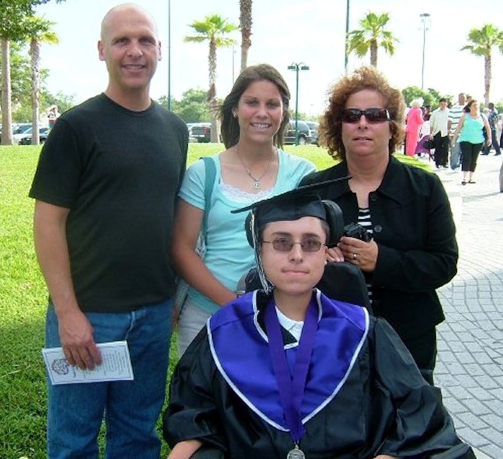 	From left: Elysse’s father Lance, Elysse, brother Greg and mother Debby pictured on Greg’s graduation from Timber Creek High School in Orlando, Fla., in 2007.  