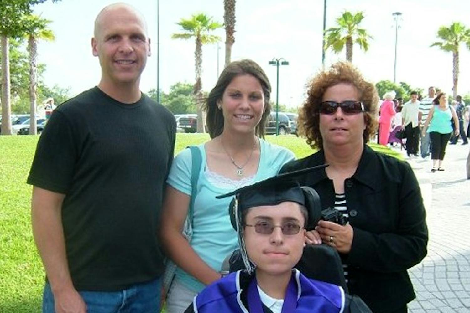 From left: Elysse’s father Lance, Elysse, brother Greg and mother Debby pictured on Greg’s graduation from Timber Creek High School in Orlando, Fla., in 2007.