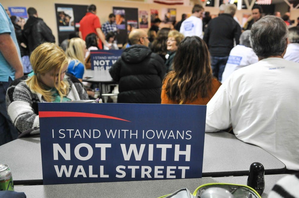 Bernie Sanders's supporters displayed signs to designate the support area at the Democratic caucus in Clive, IA. 