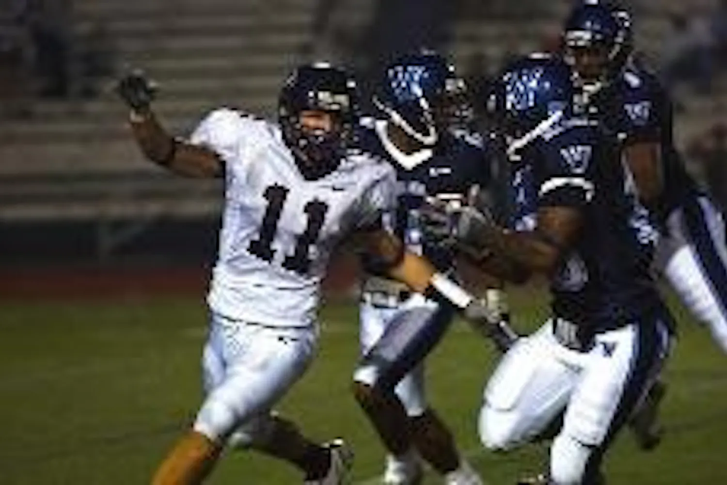 Football Notebook | Teammates ogle Maugle's visor