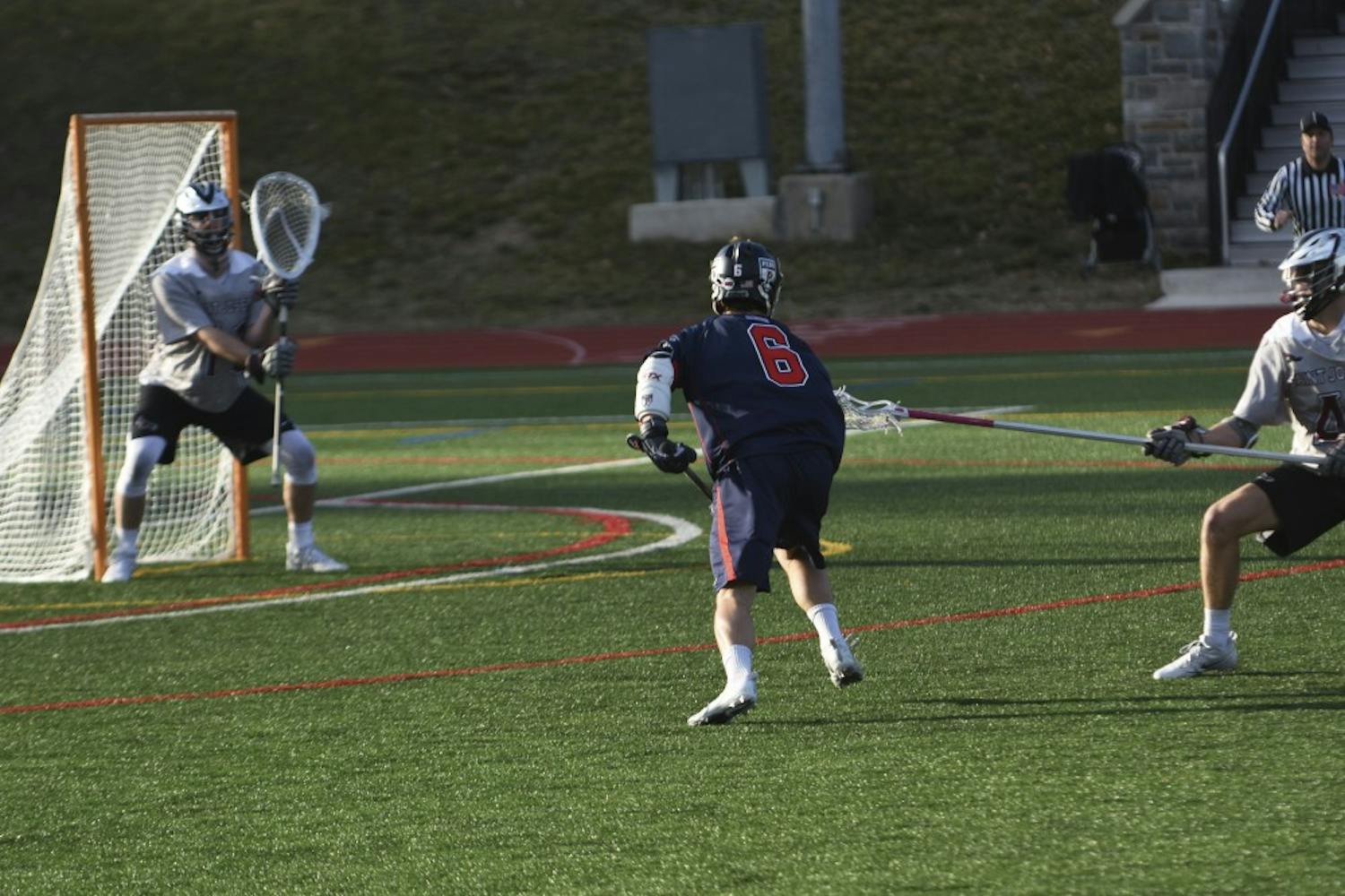 With the help of sophomore goalie Reed Junkin and his staggering 16 saves, Penn men's lacrosse kept No. 6 Virginia's comeback efforts at bay in an unbelievable 11-10 upset win.