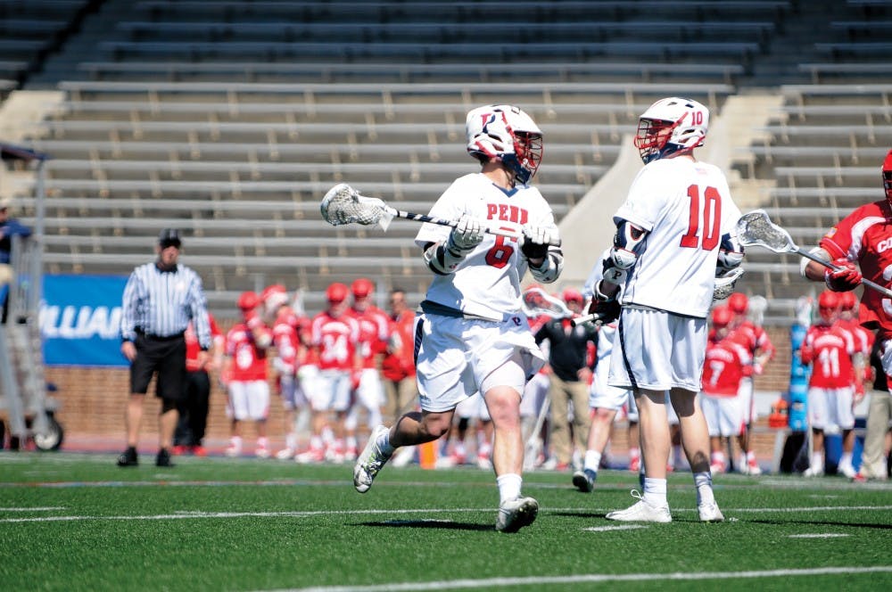 A hat trick from freshman Alex Roesner (6) helped Penn men's lacrosse take a 6-0 lead over Cornell on Sunday as the Quakers held off the Big Red, 9-6.