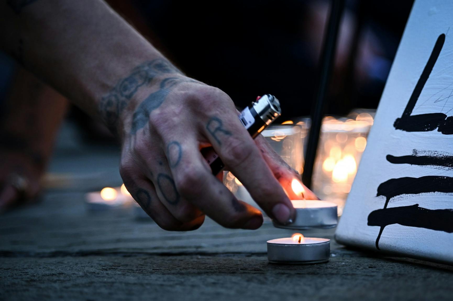 09-15-20 Trump Pence Out Now Protest Vigil Candles.jpg
