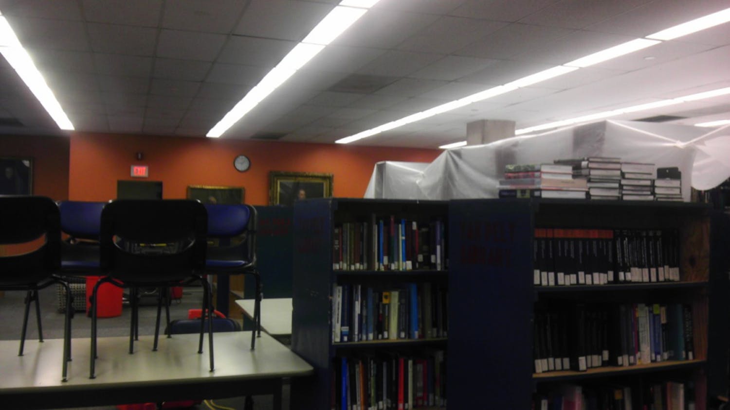 Bookshelves in the Biomedical library were put under a plastic cover to protect from further water damage.