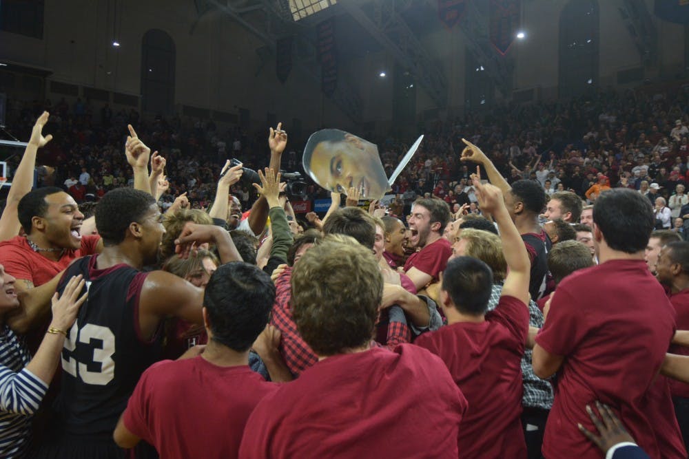 The celebration is on as Harvard won its fourth straight NCAA Tournament bid. The Crimson fans stormed the Palestra floor and celebrated with the players at midcourt.