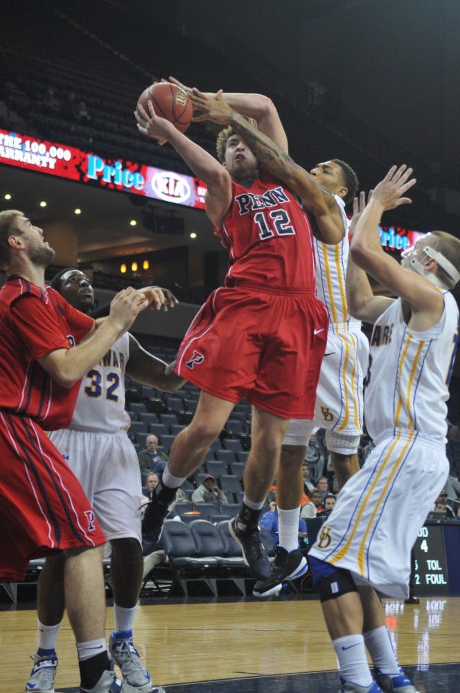 	Junior forward Fran Dougherty led all scorers with 21 points in Penn’s 84-69 loss to Delaware in the Quakers’ first game of the NIT Season Tip-Off Tournament at the University of Virginia Monday. He added six rebounds, two steals and two blocks.