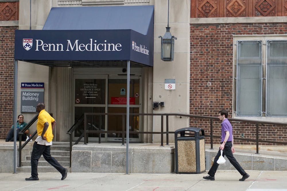 penn-medicine-maloney-building-people-walking-penn-campus