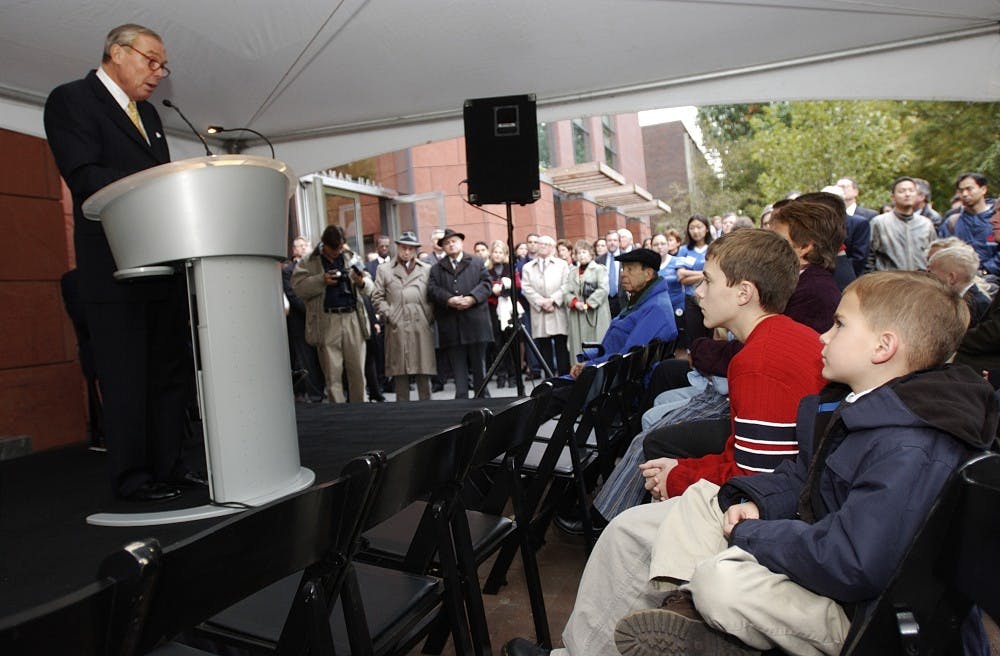 Jon Huntsman addresses the crowd as his grandchildren look on before the official opening of Huntsman Hall.  The dedication, beginning Friday morning with VP Cheney's closed speech, was open for the public that afternoon.