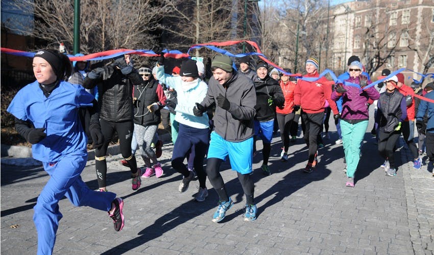 Amy Guttmann speaking as part of a launch of a new sports program between West Philly elementary schools and Penn Athletics
