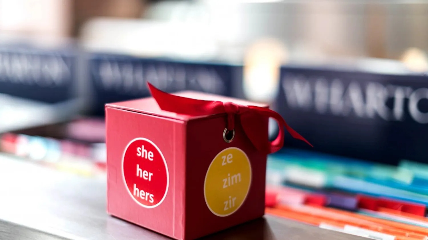 Out4Biz, Wharton's LGBT MBA student club, created and distributed stickers with various gender pronouns for Transgender Day of Remembrance on Wednesday morning. | Courtesy of Caroline Kim