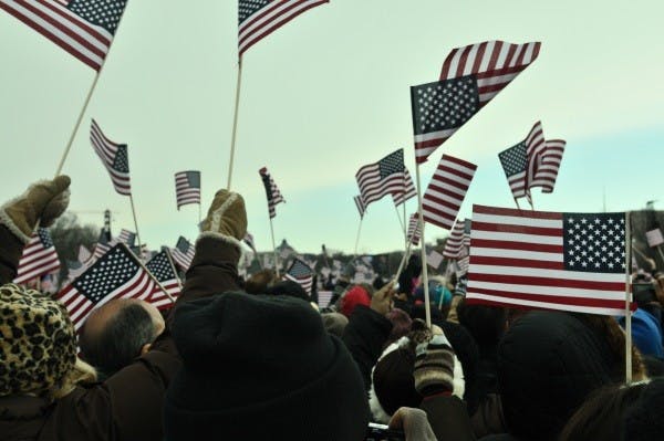 	Spectators look along the National Mall look on as President Barack Obama is inaugurated for a second time. 