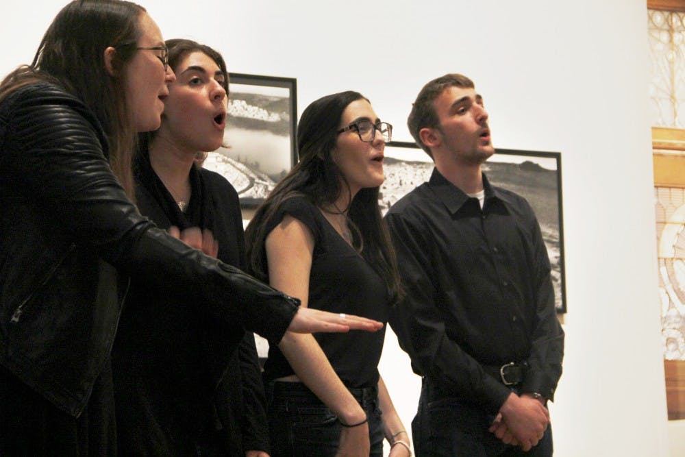 The Shabbatones, Penn's Jewish a cappella group, performed at the party in front of displays of Abbas's works.