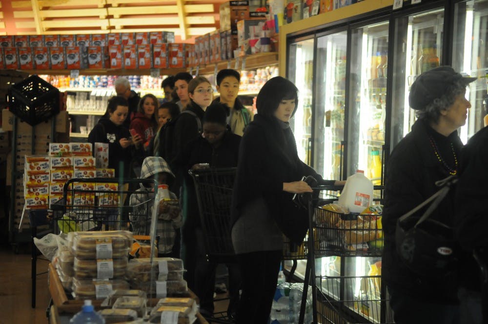 Students pack Fresh grocer in preparation for Hurricane Sandy