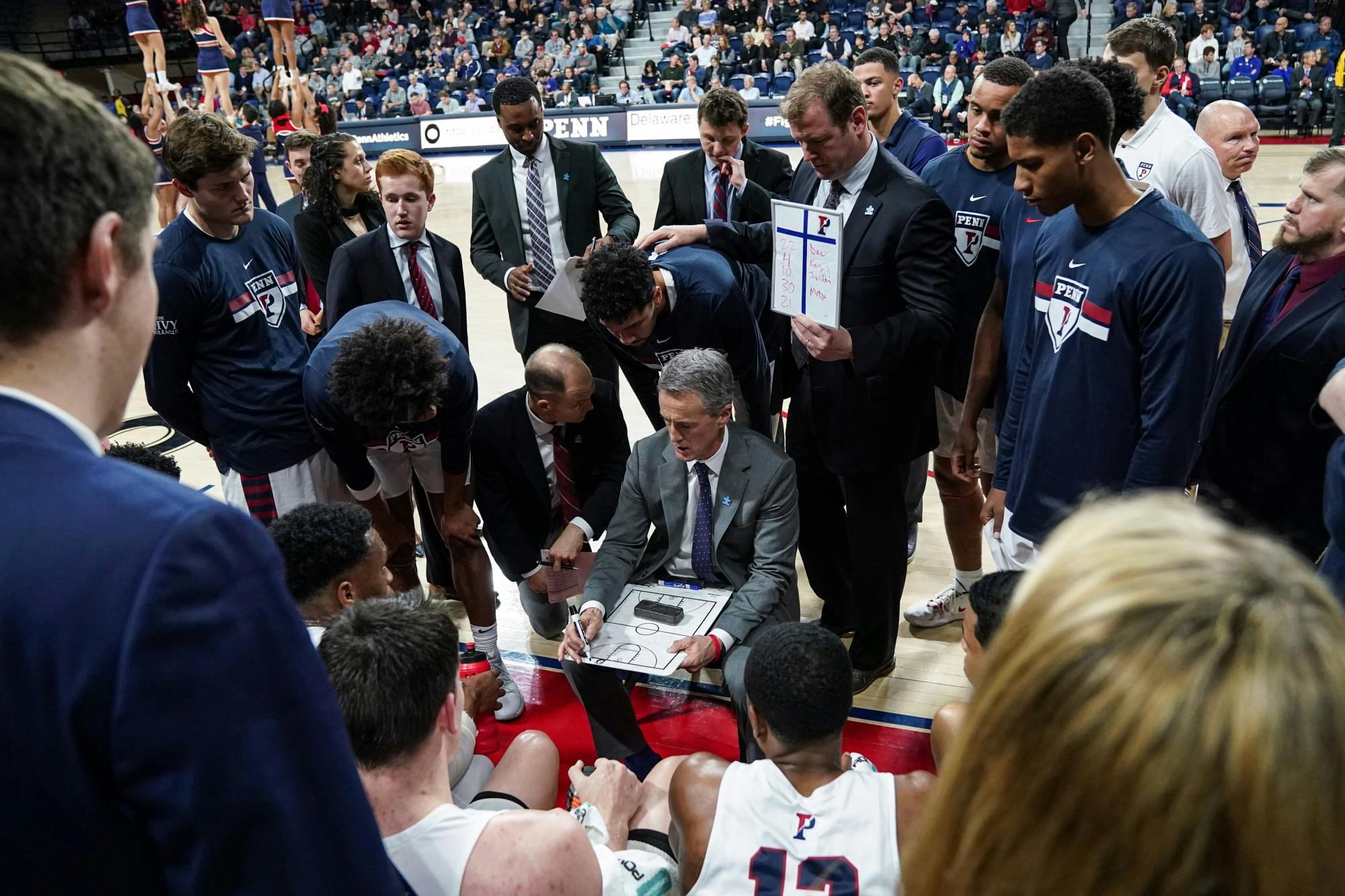 Coach Steve Donahue and Men's Basketball Team Huddle.jpg