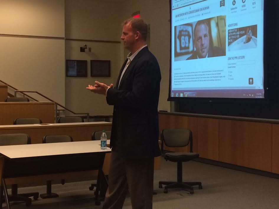 Former Philadelphia Eagles offensive tackle and current U.S. Congressman Jon Runyan (R-NJ) speaks to Penn students at Huntsman Hall on Tuesday night.