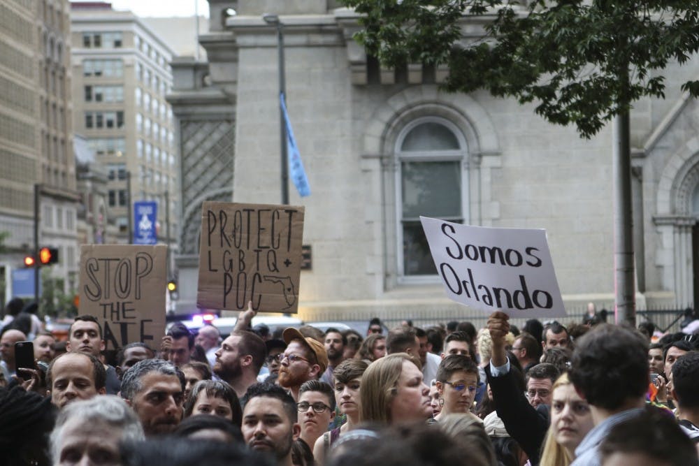 A protest and vigil was held at City Hall the day after 49 were killed in a mass shooting in Orlando, Fla.