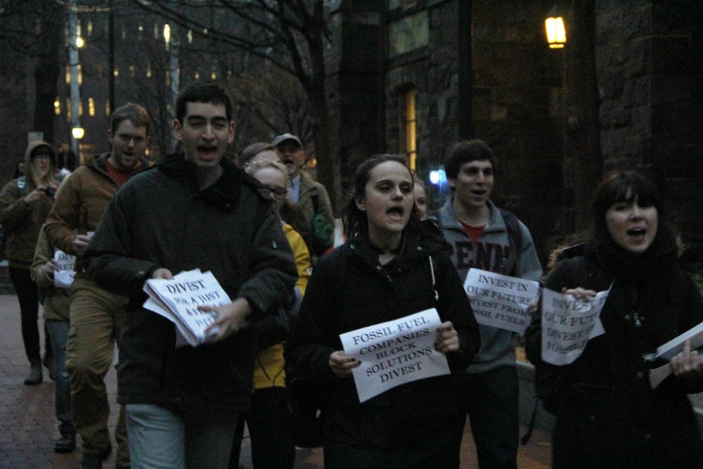 Students marched from the Fossil Free Penn rally on College Green to the UC open forum, chanting 