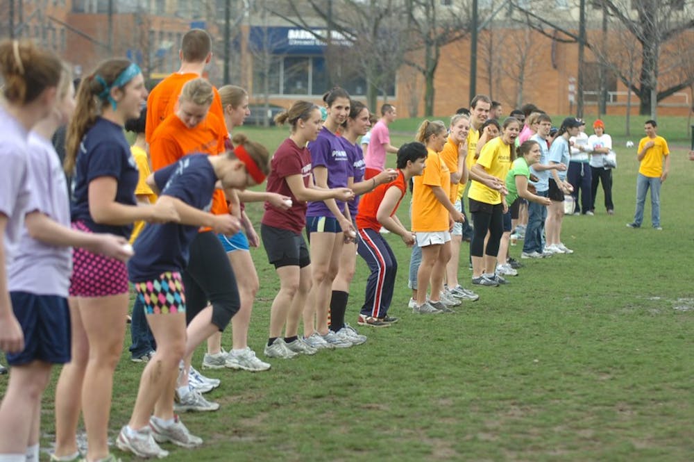 QPenn Field Games, Penn athletes and LGBT community compete in field games such as two-legged race, egg drop, eating contest, and drag racing.
Amanda gets ready for egg drop