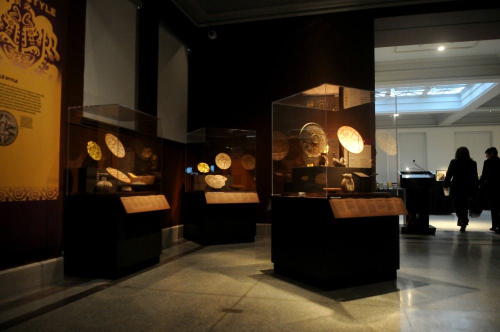 Objects uncovered at the excavation site included large golden plaques and painted ceramics.