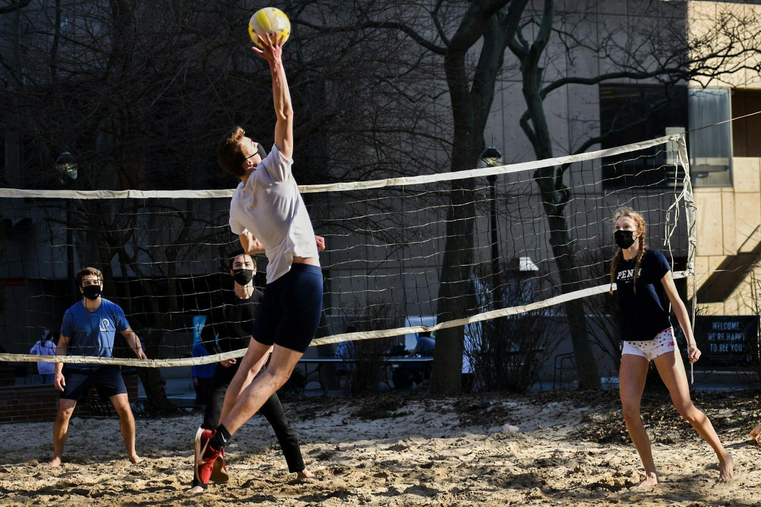 03-10-21 COVID-19 Masks Volleyball Spike Harnwell Locust Walk Volleyball Court Spring Stay (Ana Glassman).jpg