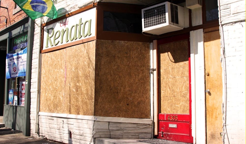 Café Renata windows were boarded up after the café caught fire last Thursday.